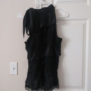 Black sleeveless turtleneck blouse